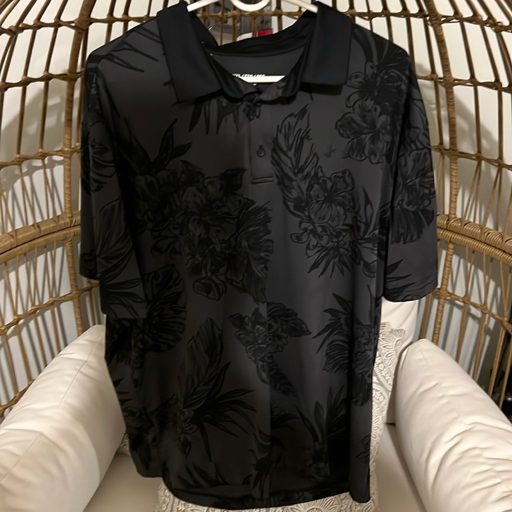 Men’s Under Armor XXL Black Polo with flower design all over.